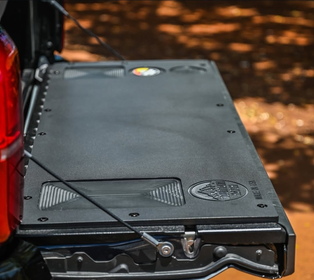 Mountain Hatch recessed-pocket tailgate table installed on a 2024+ Toyota Tacoma tailgate with drink holders and utility tray
