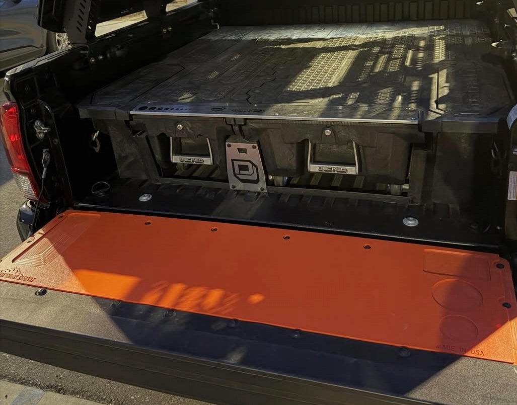 Orange Mountain Hatch panel on a Tacoma tailgate with a bed drawer system behind it