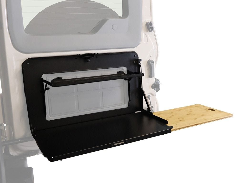 Drop down tailgate table open on a Grenadier rear door with the bamboo work surface extension slid out to the side
