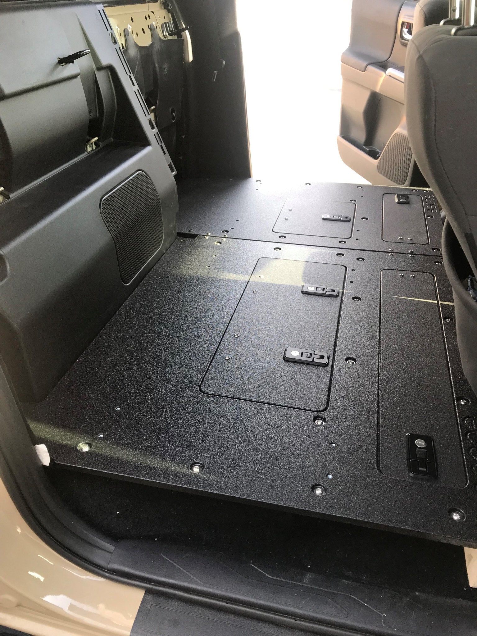 Toyota Tacoma 2005-2023 2nd and 3rd Gen. Double Cab - Second Row Seat Delete Plate System keeping Factory Back Wall 60% Passenger Seat Delete with Factory Back Wall / Factory Subwoofer Seat Delete Plate System Goose Gear- Overland Kitted