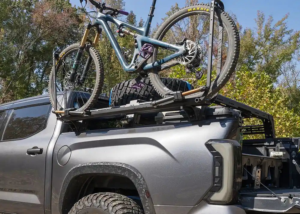 Toyota Tundra Mid Height bed rack with an optional bike mount accessory