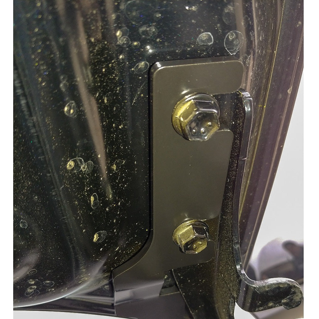 HMOR ditch light bracket bolted at the Tacoma hood hinge