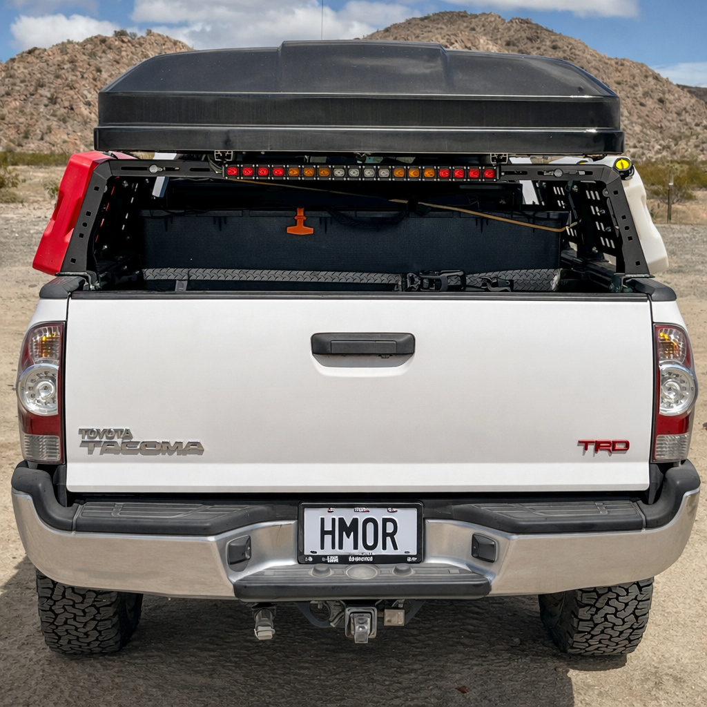 Rear view of Tacoma TRD with ROCK-IT rack, tent and LED light bar