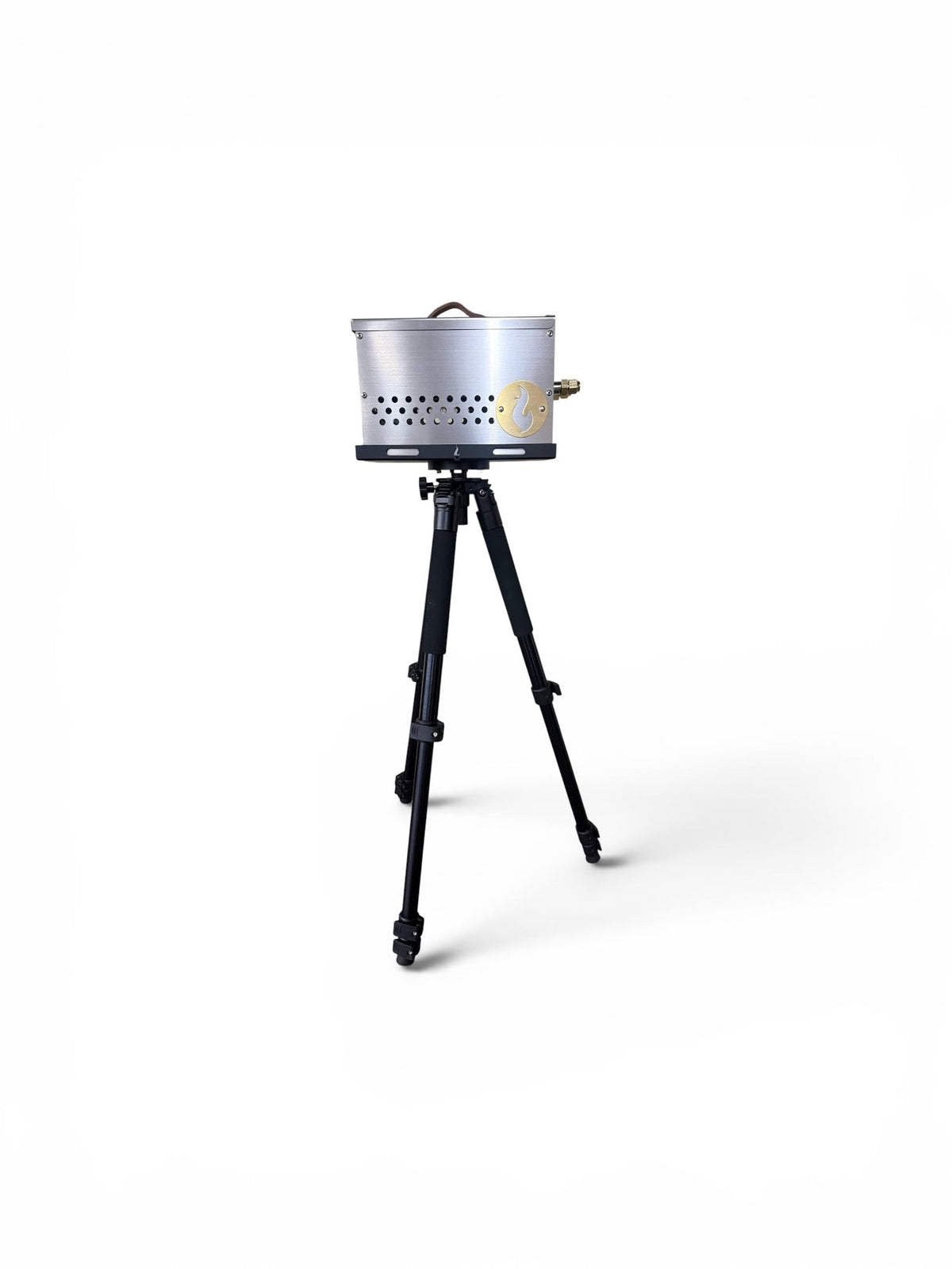 Stainless steel firebox mounted on the tripod stand, studio shot on white background